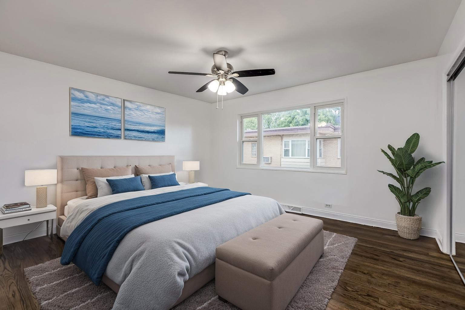 5107 North Springfield Avenue, Unit B Chicago, IL 60625 - Photo 13 of 25 a bedroom with a bed and a window