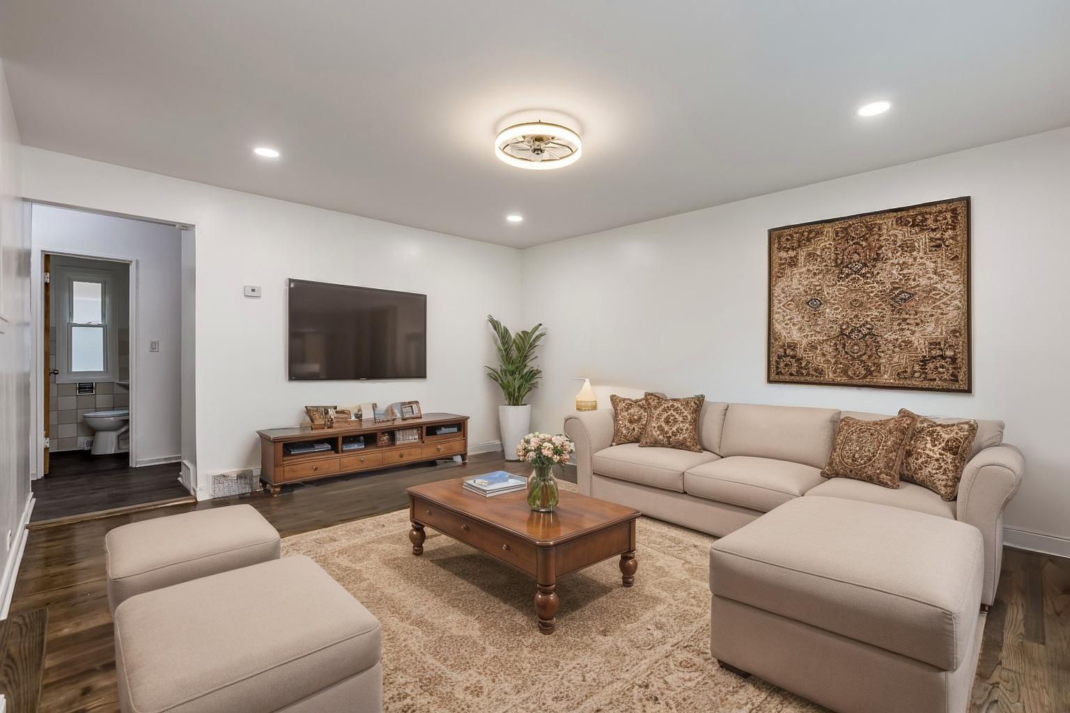 5107 North Springfield Avenue, Unit B Chicago, IL 60625 - Photo 2 of 25 a living room with furniture and a flat screen tv