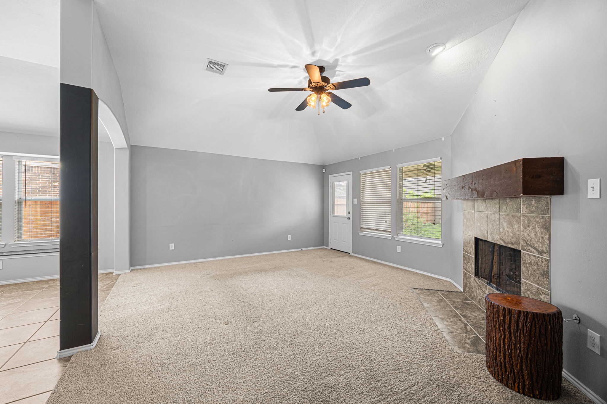 2211 Oak Rise Drive Conroe, TX 77304 - Photo 15 of 29 Living room with fireplace and natural light