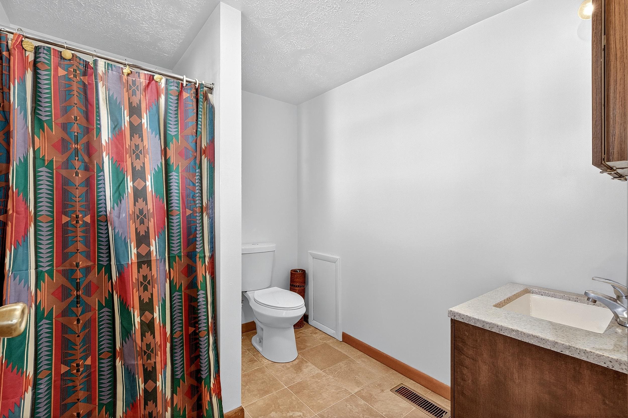 87 Merseles Street, Unit 2 Jersey City, NJ 07302 - Photo 14 of 16 a bathroom with a toilet and a sink