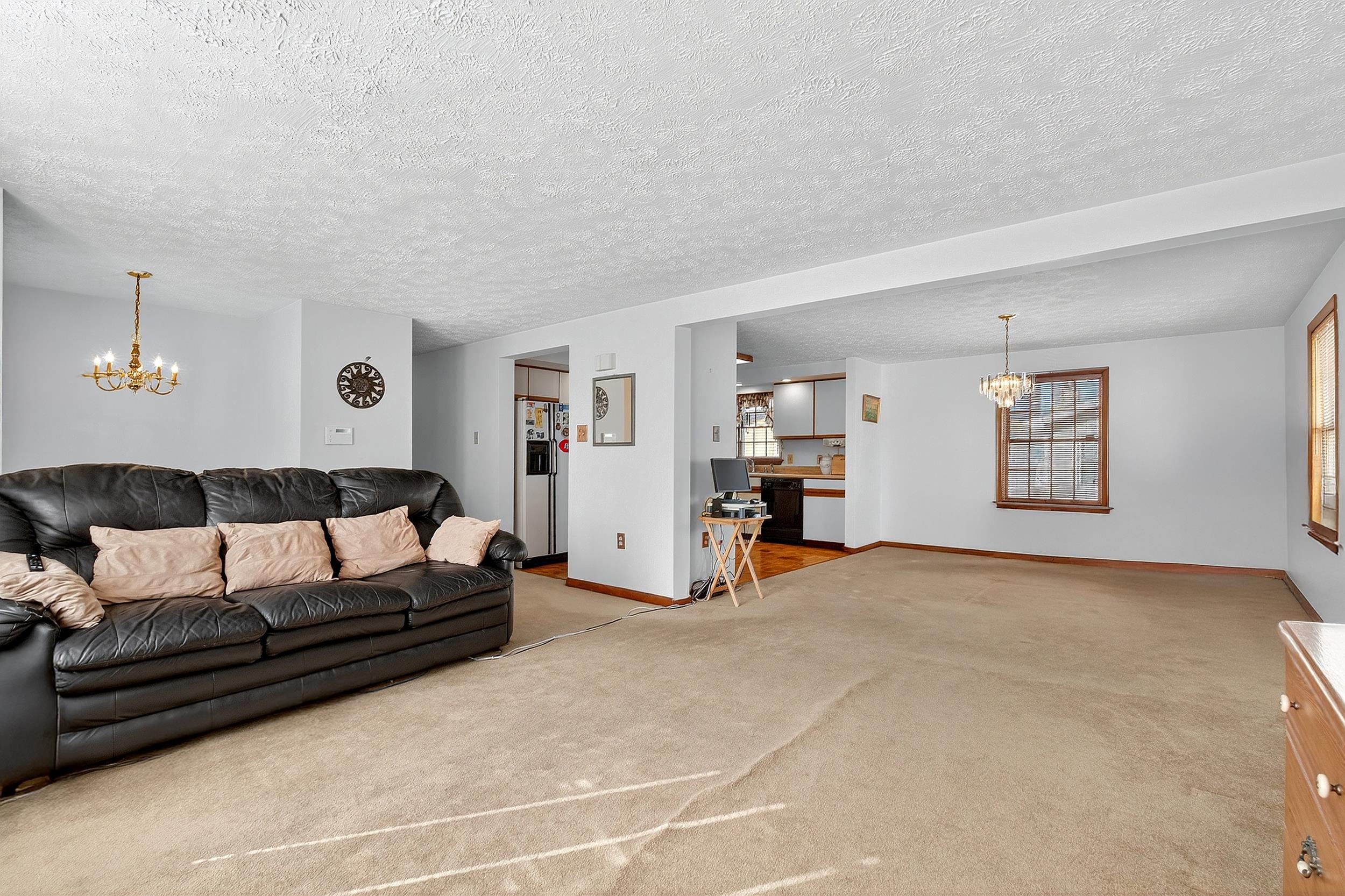 87 Merseles Street, Unit 2 Jersey City, NJ 07302 - Photo 3 of 16 a living room with furniture and a couch