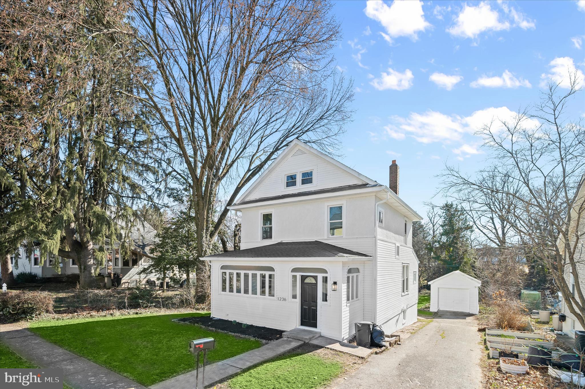 1236 Elm Ridge Avenue Baltimore, MD 21229 - Photo 1 of 41 a front view of a house with garden