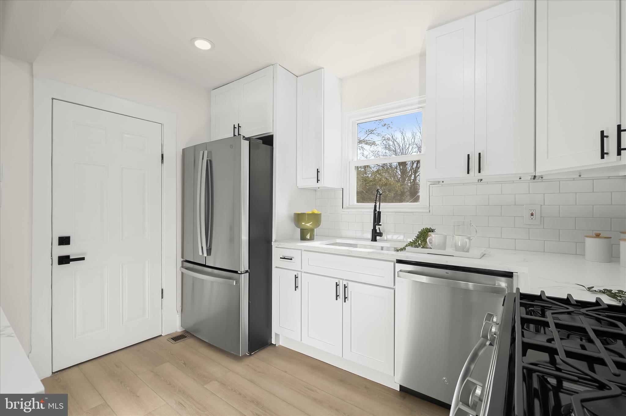 1236 Elm Ridge Avenue Baltimore, MD 21229 - Photo 13 of 41 a kitchen with a refrigerator and a sink