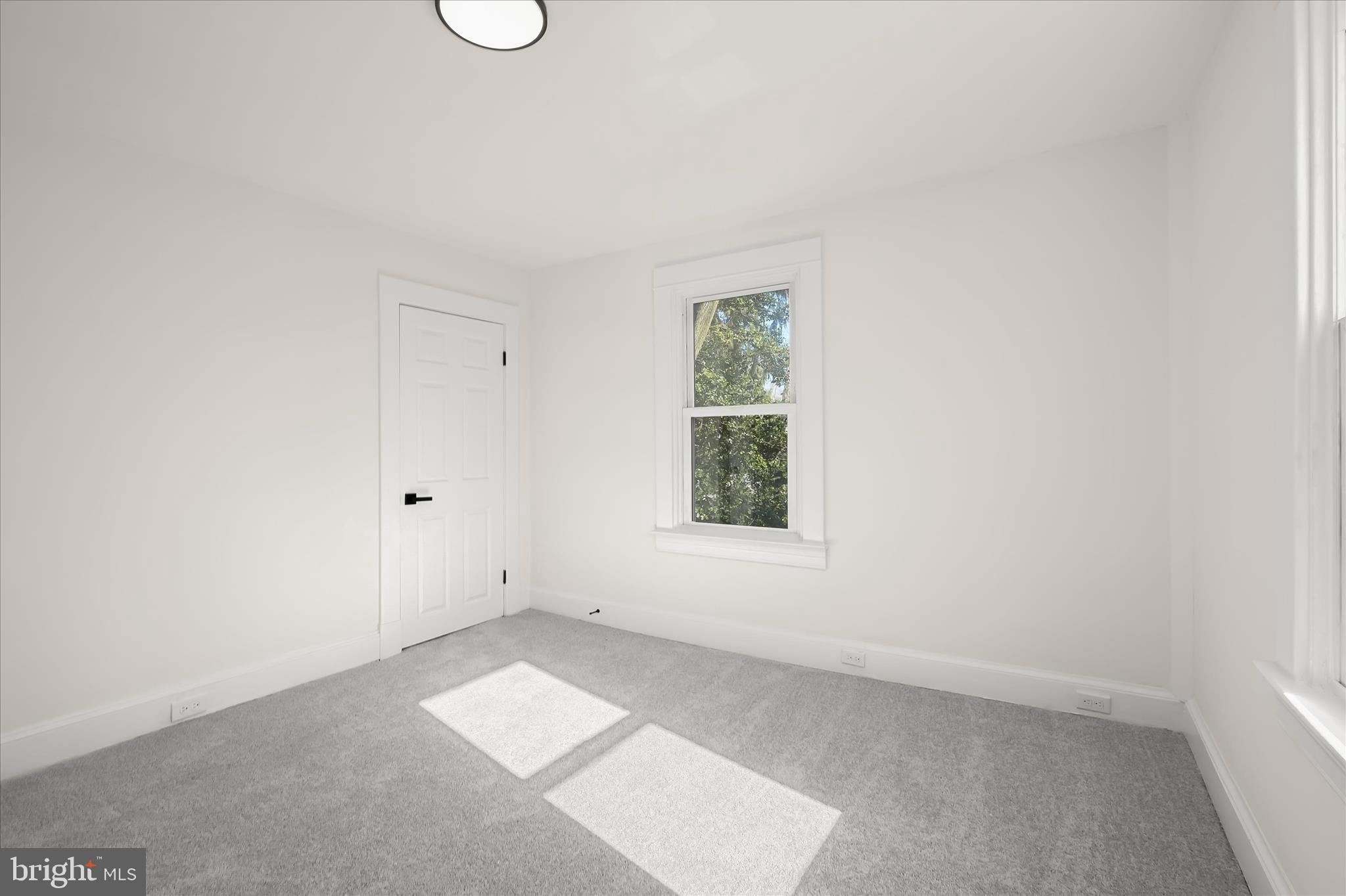 1236 Elm Ridge Avenue Baltimore, MD 21229 - Photo 22 of 41 an empty room with windows