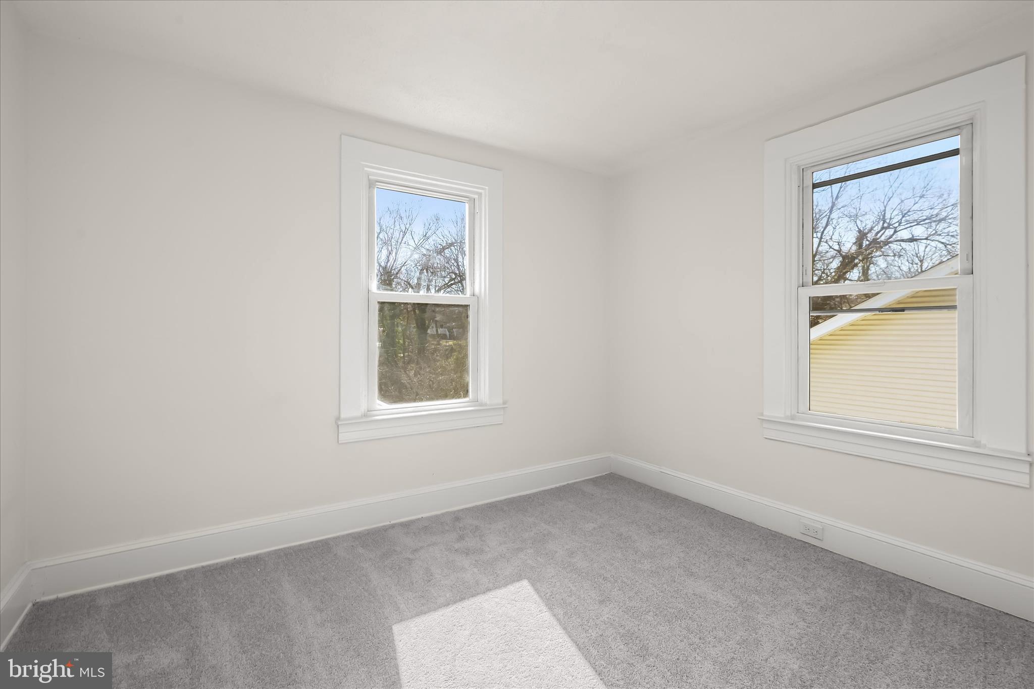 1236 Elm Ridge Avenue Baltimore, MD 21229 - Photo 23 of 41 an empty room with windows