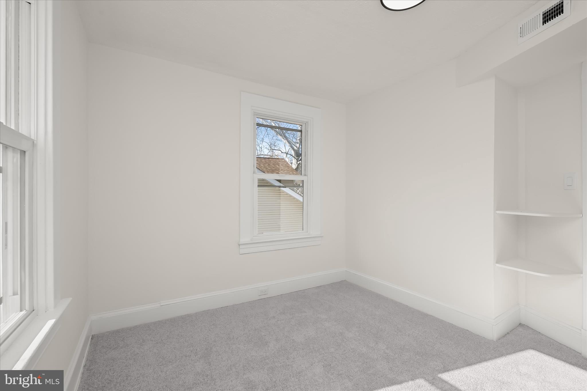 1236 Elm Ridge Avenue Baltimore, MD 21229 - Photo 24 of 41 an empty room with a window