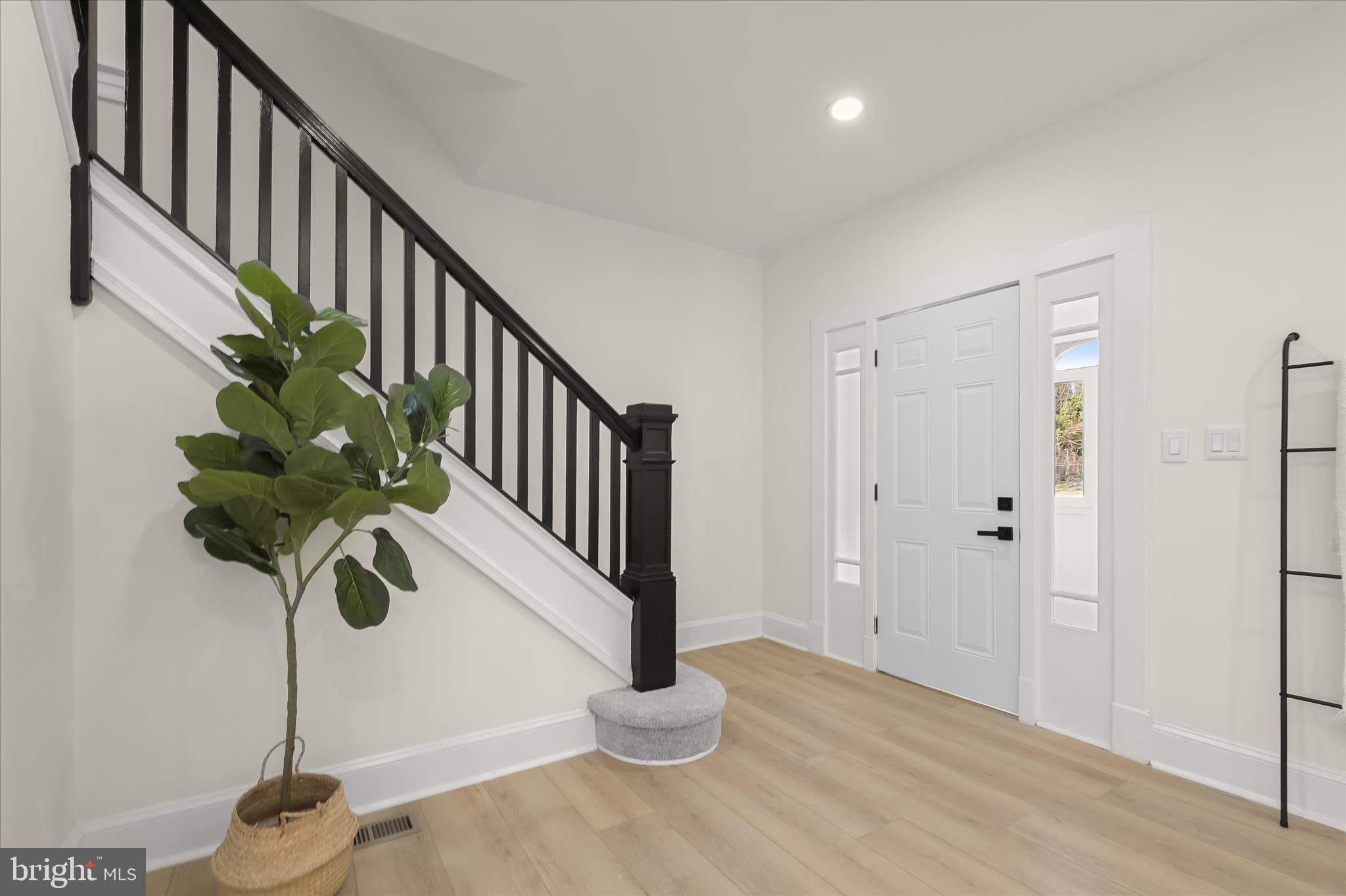 1236 Elm Ridge Avenue Baltimore, MD 21229 - Photo 7 of 41 a view of staircase with wooden floor