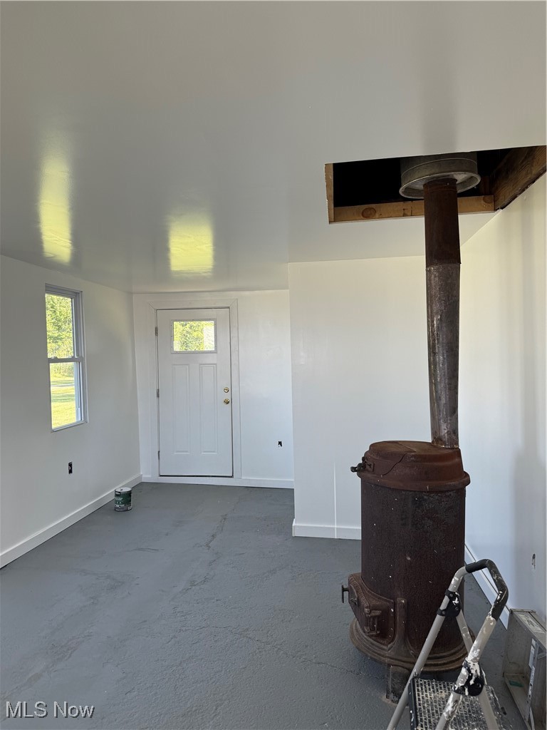 4394 Lake Road East Geneva, OH 44041 - Photo 6 of 13 Entrance foyer with baseboards and dark carpet