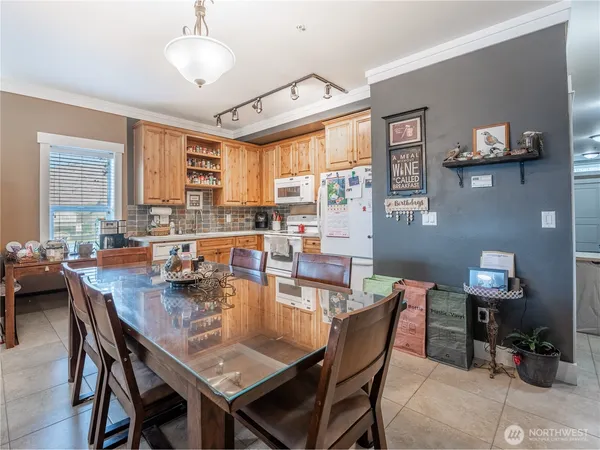 a view of a patio with table and chairs