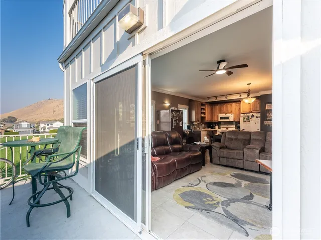a view of a chair and table in the balcony