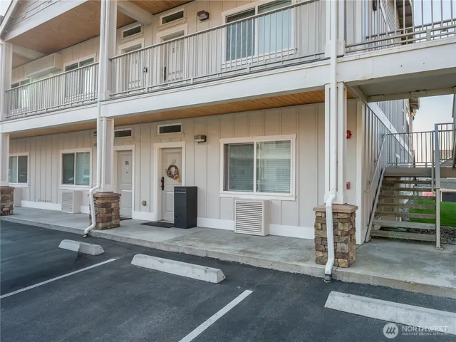 en suite bathroom with blue countertop and a shower