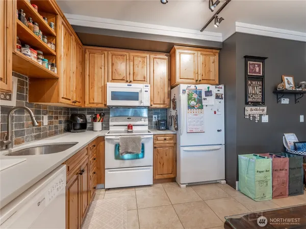 a bathroom with double vanity and a mirror