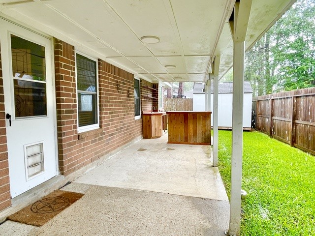 13506 Spring Court Tomball, TX 77375 - Photo 31 of 37 a view of a backyard with wooden fence and large windows