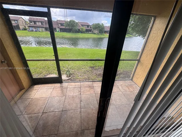 a view of a room with a large window