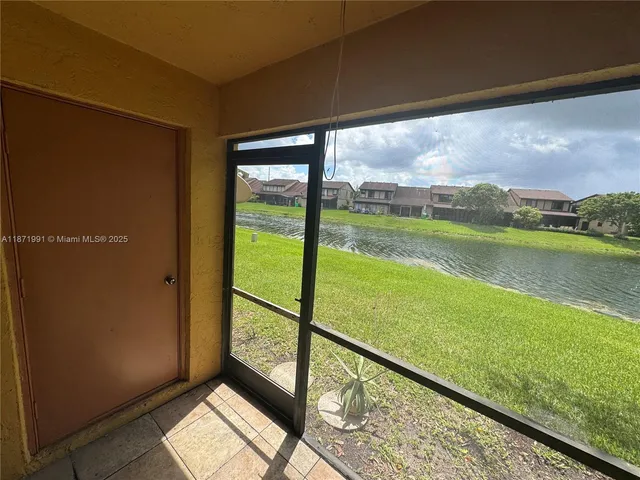 a view of swimming pool from a balcony