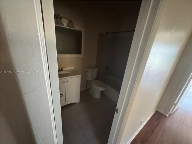 a bathroom with a sink and toilet