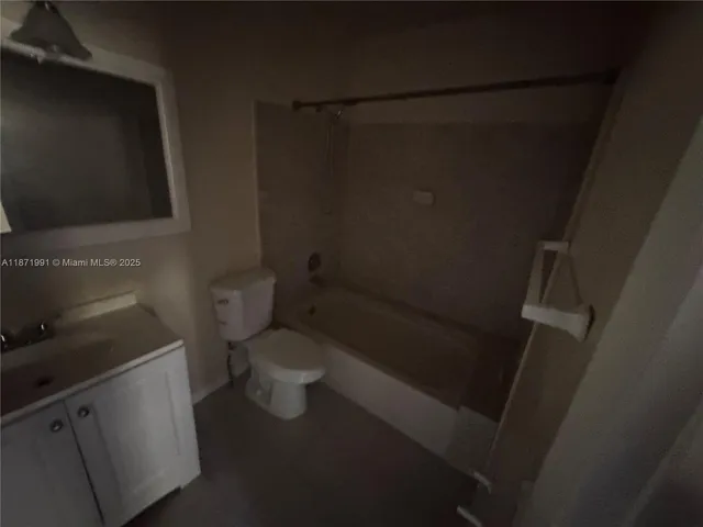 a bathroom with a toilet and a sink