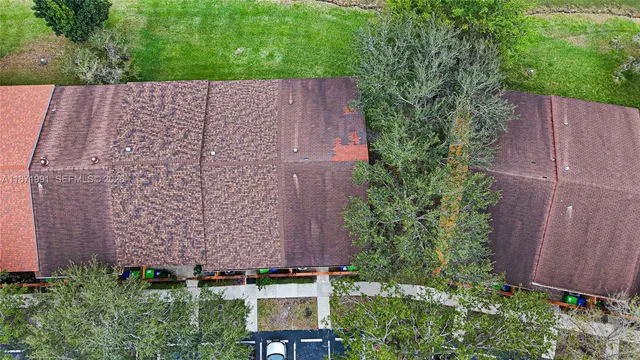 an aerial view of a house and garden