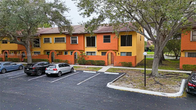 a view of a parked cars in front of a house