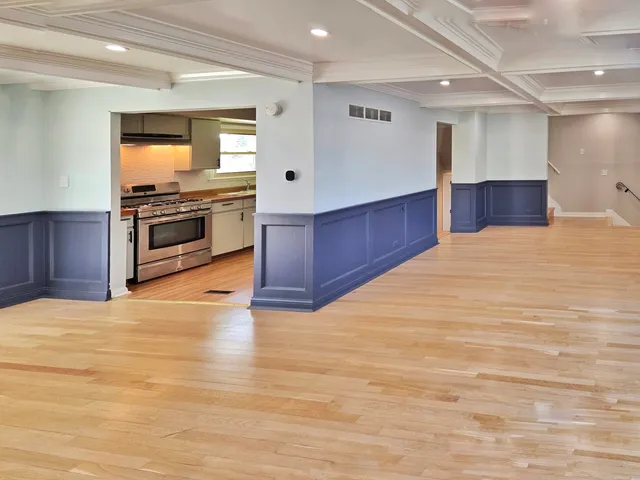 a kitchen with stainless steel appliances wooden cabinets and granite counter tops