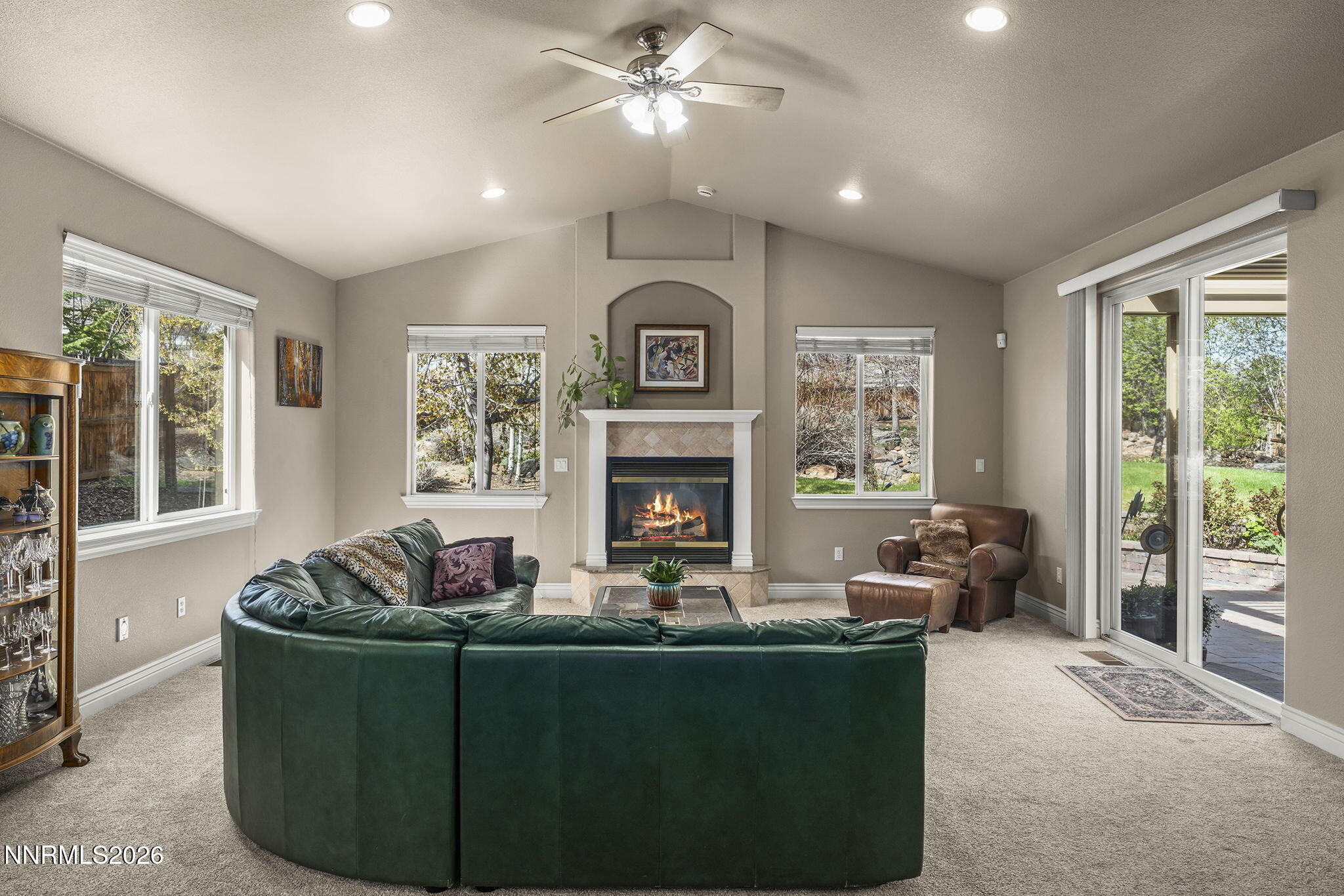 12635 Silver Wolf Road Reno, NV 89511 - Photo 25 of 48 a living room with furniture and a fireplace