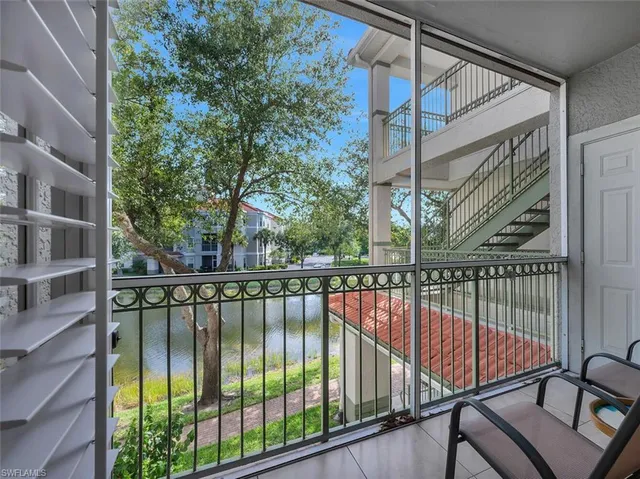 a view of staircase with a lake view