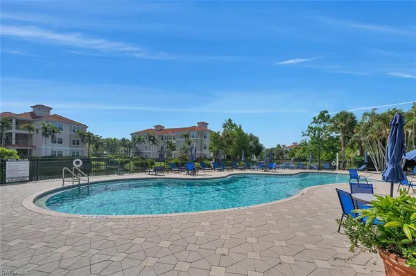 a view of a swimming pool and a yard