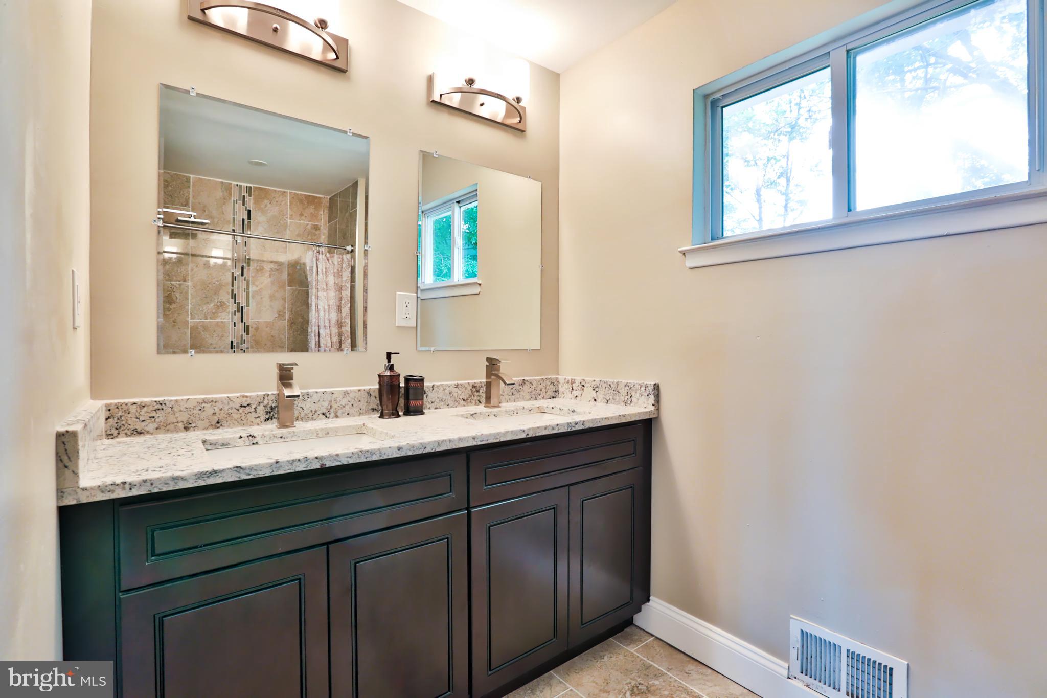 3919 Tiverton Road Randallstown, MD 21133 - Photo 13 of 26 Dual Vanities And Tile Shower