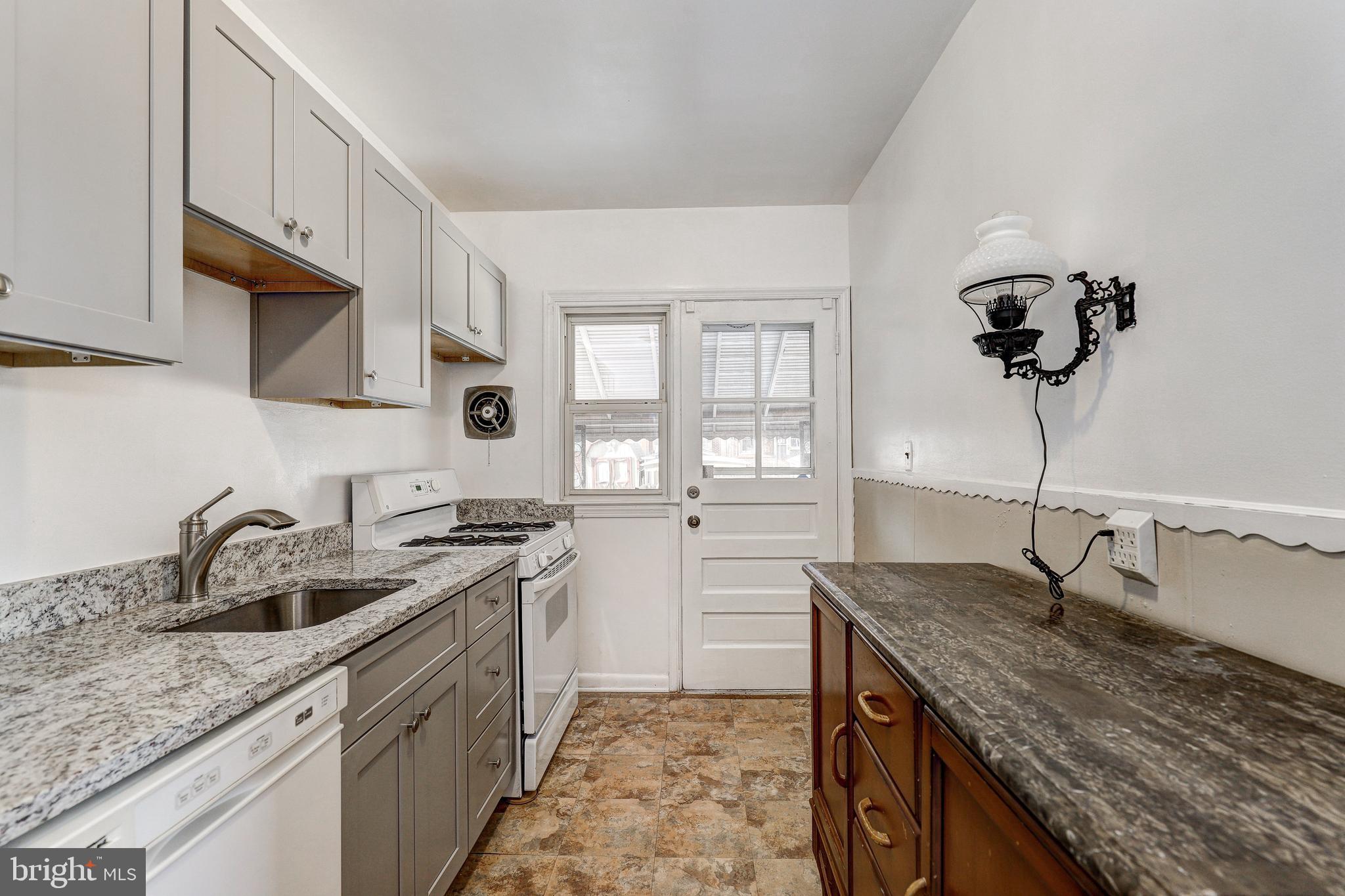 70 Berkshire Road Essex, MD 21221 - Photo 11 of 30 Refrigerator, dishwasher and gas stove convey