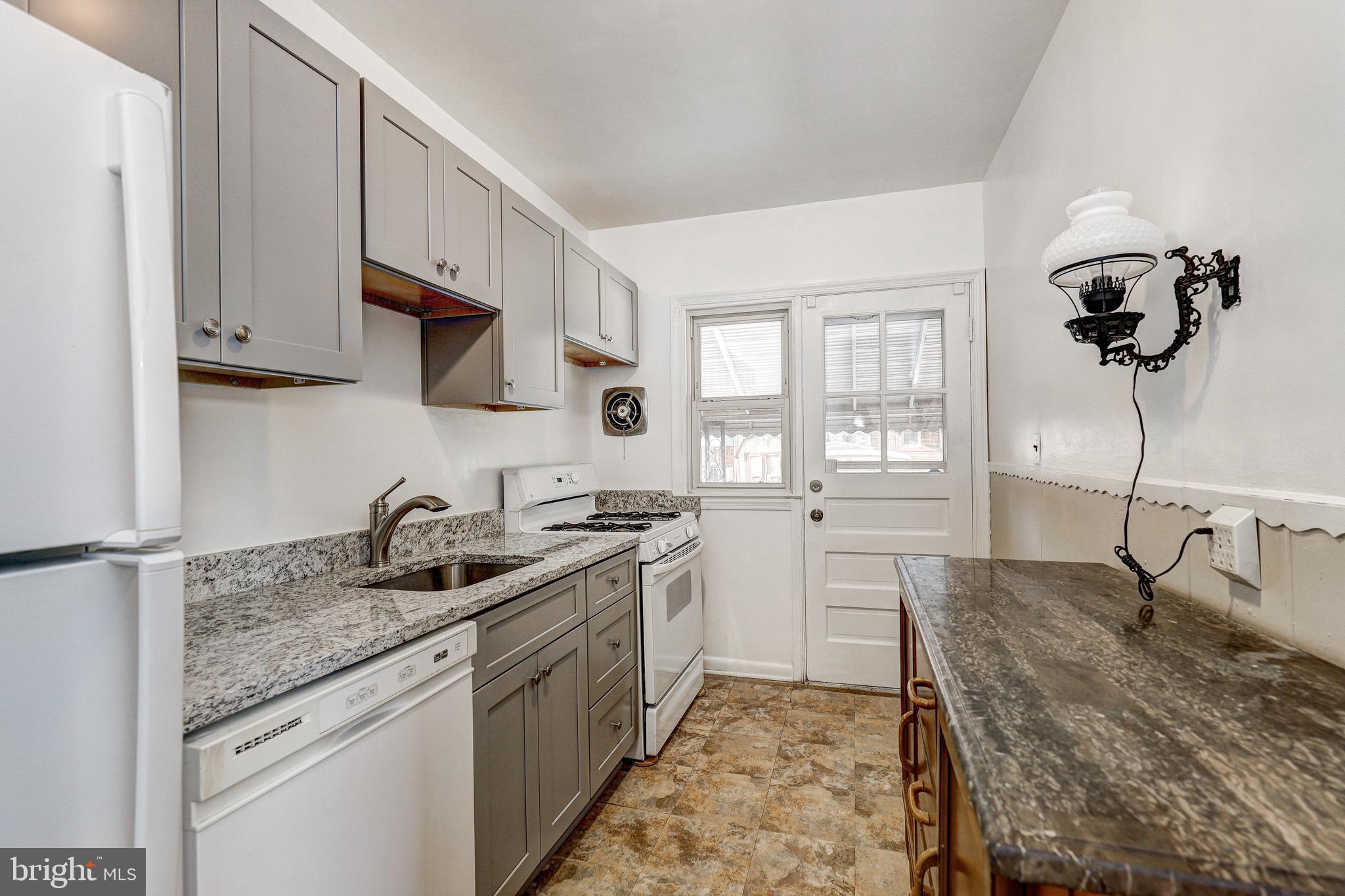 70 Berkshire Road Essex, MD 21221 - Photo 9 of 30 New kitchen cabinets w/granite counter-tops