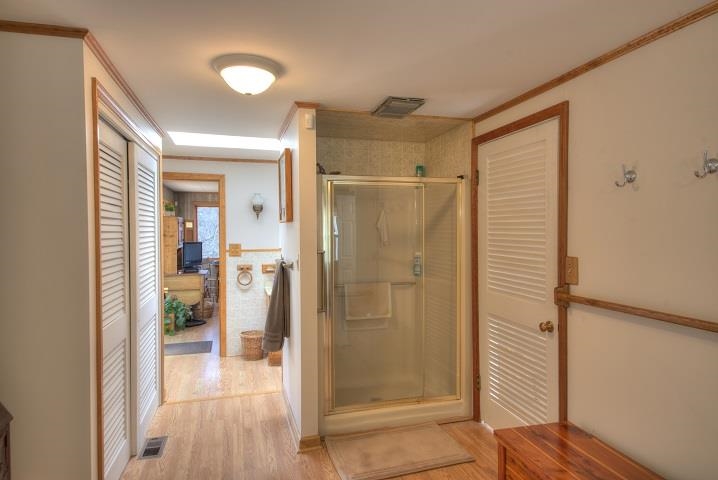 1310 New Hope Road Staunton, VA 24401 - Photo 12 of 62 a view of a bathroom with a glass door and shower