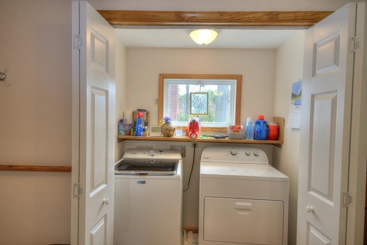 1310 New Hope Road Staunton, VA 24401 - Photo 15 of 62 a utility room with dryer washer and a view of living room
