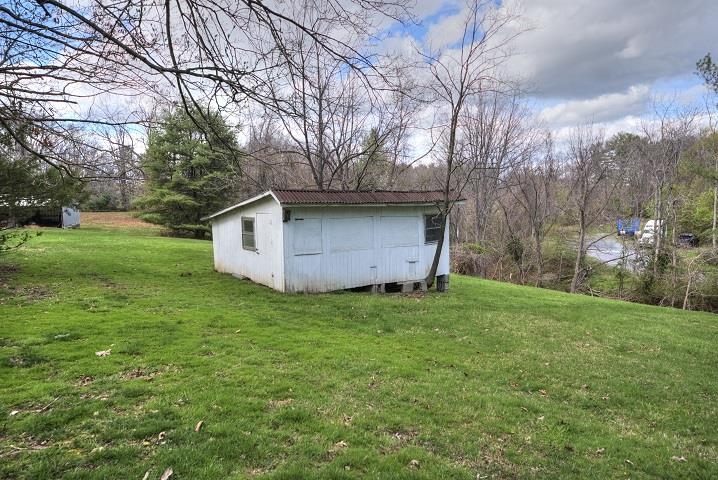 1310 New Hope Road Staunton, VA 24401 - Photo 34 of 62 a view of a backyard with large trees
