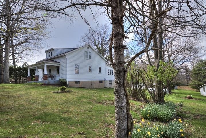 1310 New Hope Road Staunton, VA 24401 - Photo 35 of 62 a view of a yard with a house and a large tree
