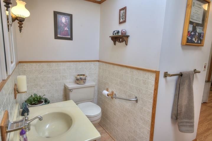 1310 New Hope Road Staunton, VA 24401 - Photo 47 of 62 a white toilet sitting next to a bathroom sink and tub