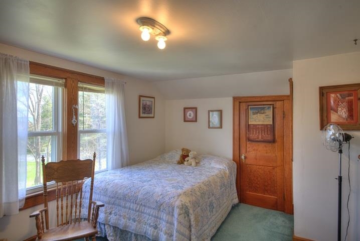 1310 New Hope Road Staunton, VA 24401 - Photo 48 of 62 a bedroom with a bed and wooden floor