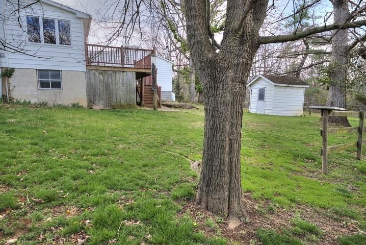 1310 New Hope Road Staunton, VA 24401 - Photo 58 of 62 a view of a yard in front of a house with a large tree