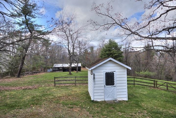 1310 New Hope Road Staunton, VA 24401 - Photo 60 of 62 a front view of house with a yard and trees