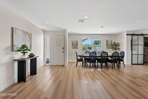 a view of a dining room with furniture window and wooden floor