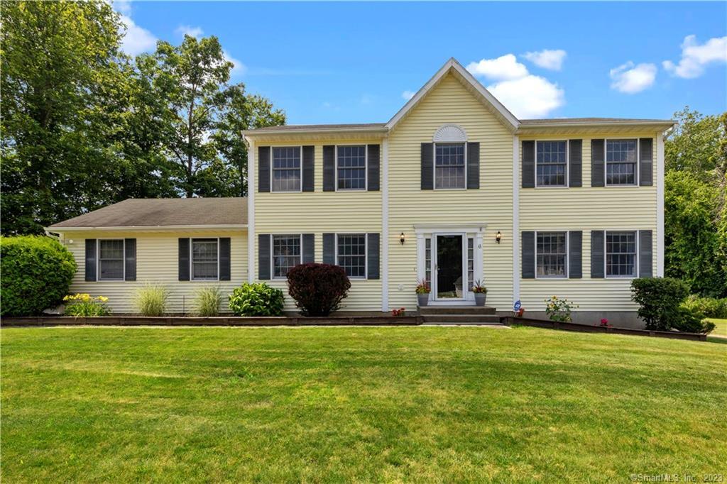 6 Millbrook Road Bethel, CT 06801 - Photo 1 of 1 a front view of a house with a yard and trees