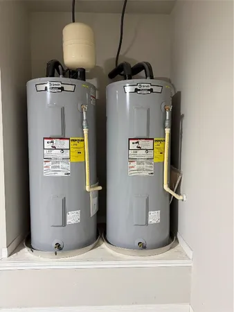 a large kitchen with stainless steel appliances granite countertop a stove and a sink