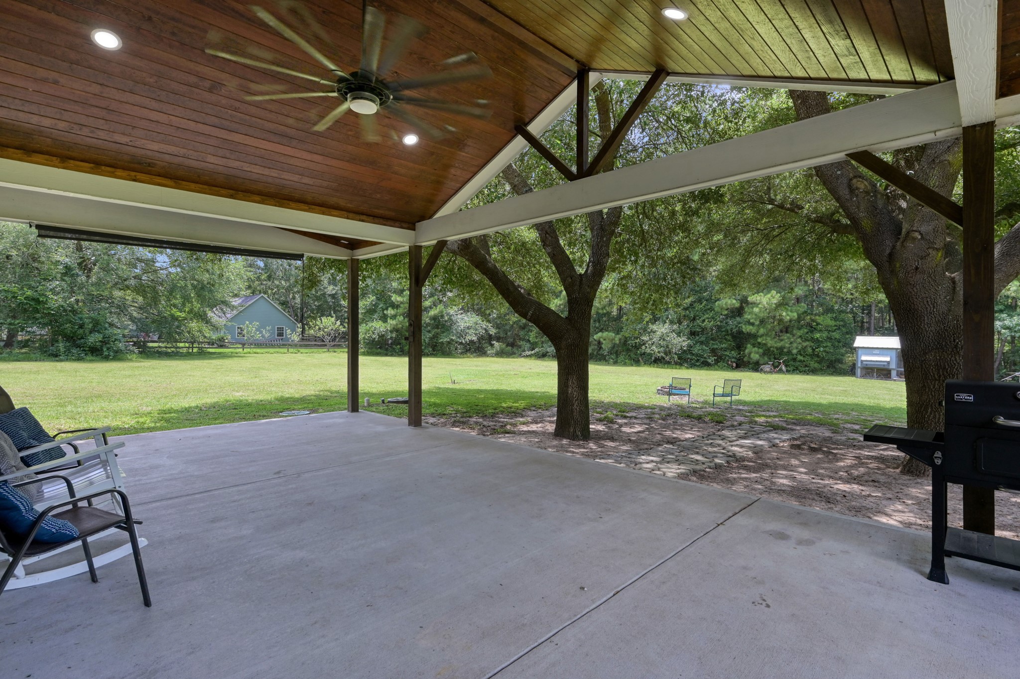 14909 Pine Tree Road Montgomery, TX 77356 - Photo 31 of 49 Beautiful back patio, perfect for enjoying the country life!