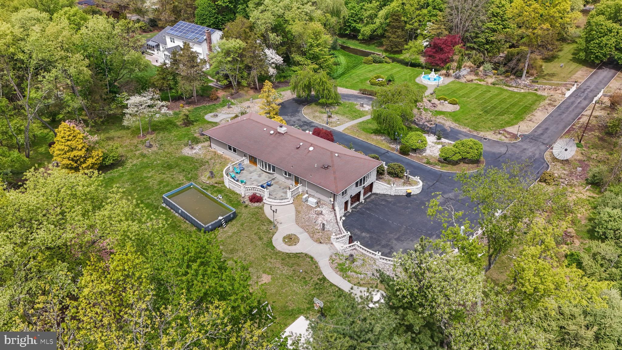 173 Butler Road Princeton, NJ 08540 - Photo 5 of 68 an aerial view of a house with a yard basket ball court and outdoor seating