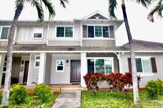 front view of a house with a yard