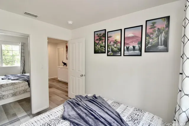 a bedroom with bed and a window