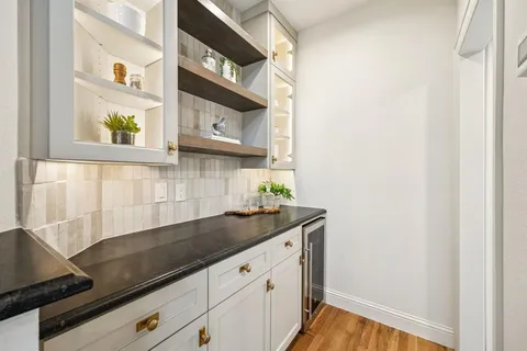 a kitchen with a sink and a window