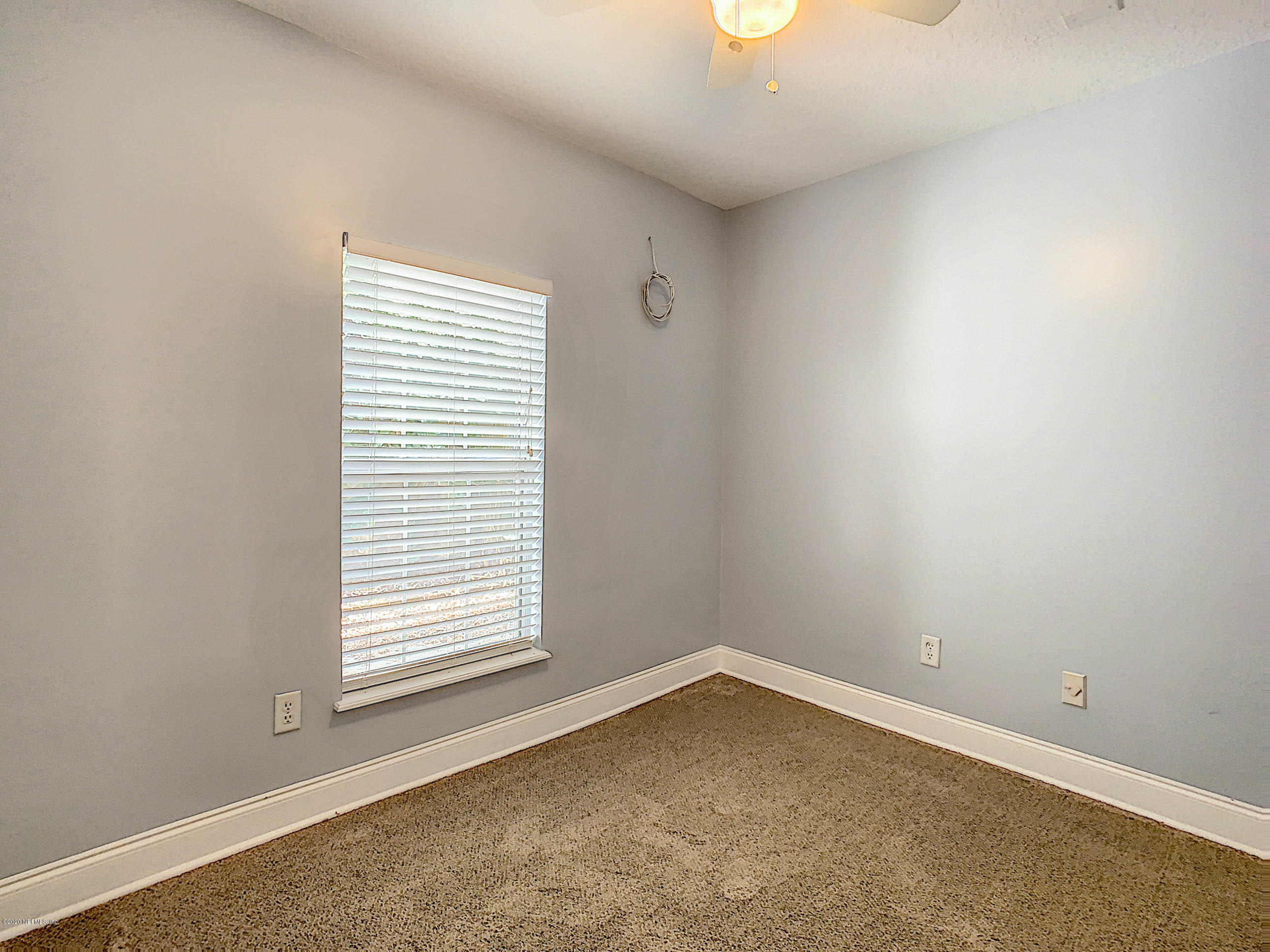 1609 First Street Neptune Beach, FL 32266 - Photo 13 of 30 an empty room with a window