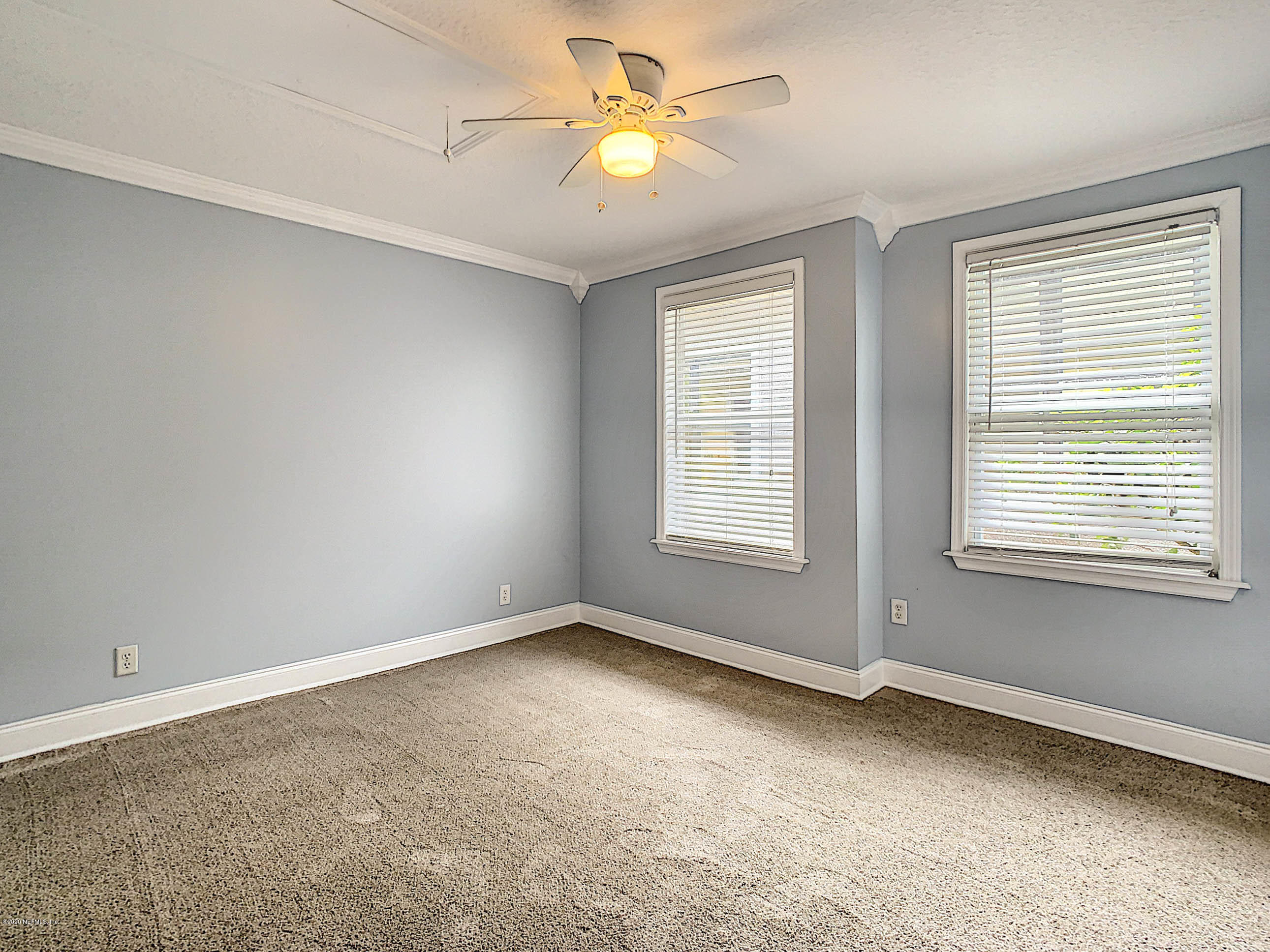 1609 First Street Neptune Beach, FL 32266 - Photo 15 of 30 a view of room with a ceiling fan and window