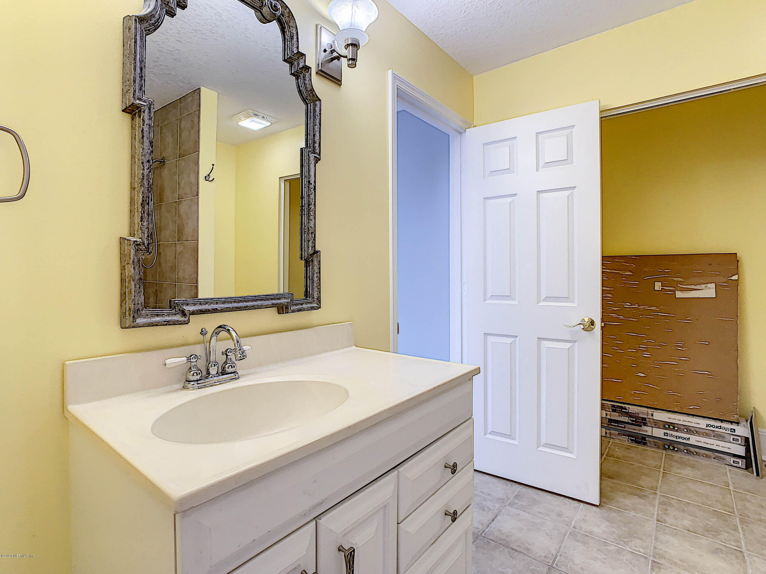 1609 First Street Neptune Beach, FL 32266 - Photo 17 of 30 a bathroom with a sink vanity and a mirror
