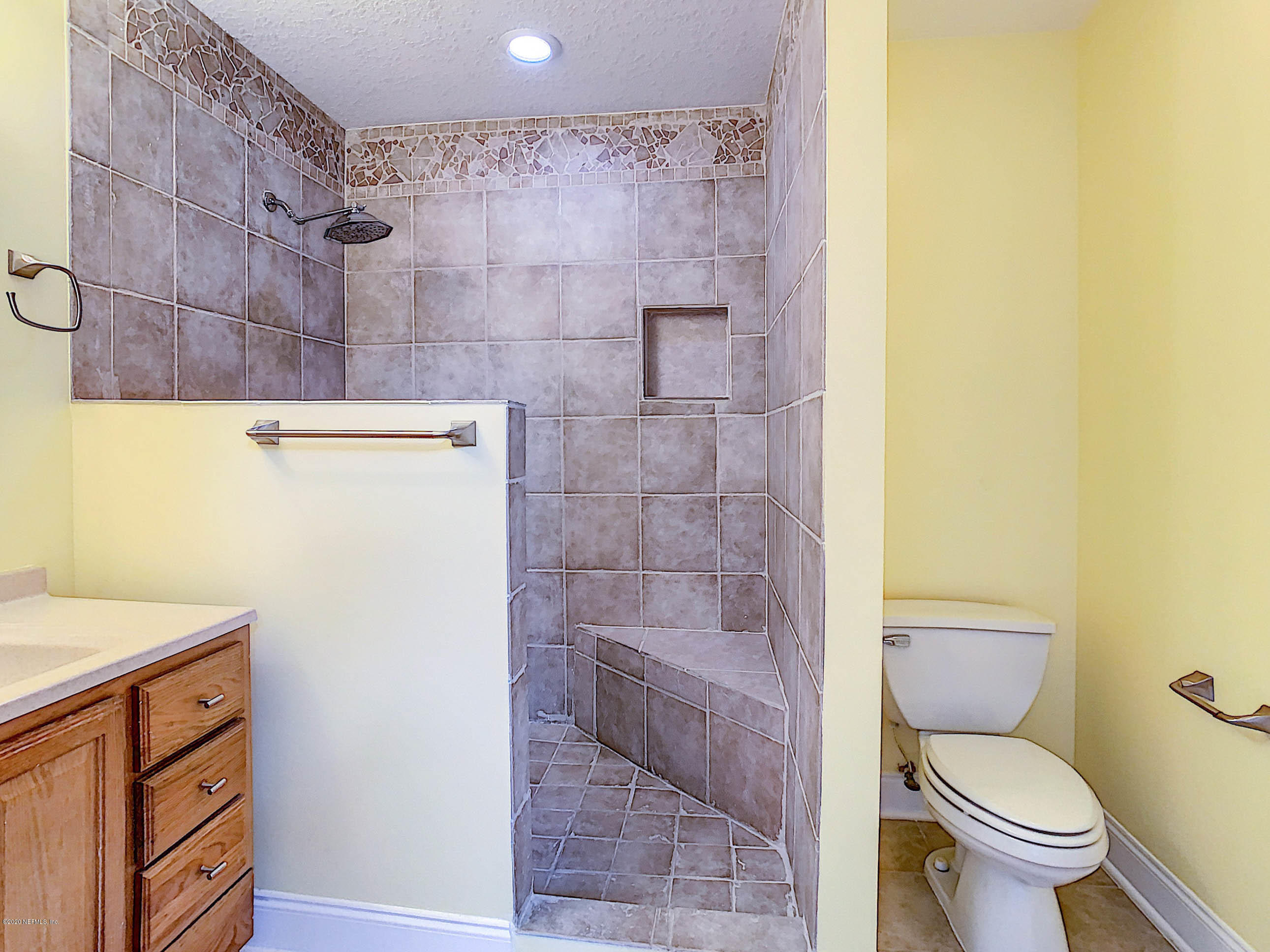 1609 First Street Neptune Beach, FL 32266 - Photo 24 of 30 a bathroom with a sink a toilet and shower